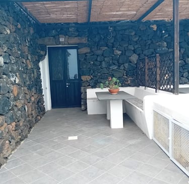 Dammuso in Sataria with stone walls near the Sataria caves