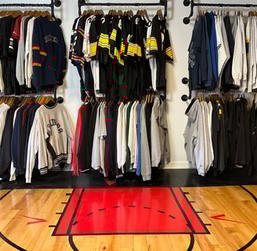 In this picture, there are football jerseys Steeler jerseys Broncos sweater, Raiders sweater