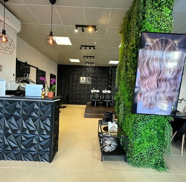 a salon and spa with a green wall