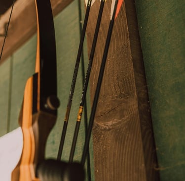 a bow and arrow in a wooden frame