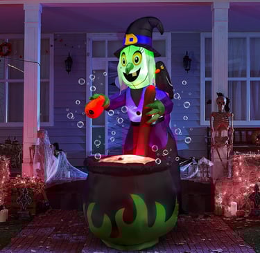Giant inflatable with with cauldron at night.