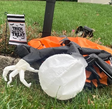 Deflated Halloween decoration needing repairs.