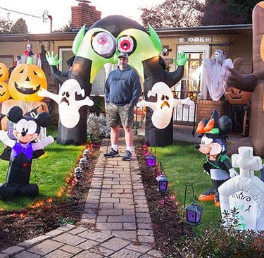 yard full of inflatable Halloween decorations