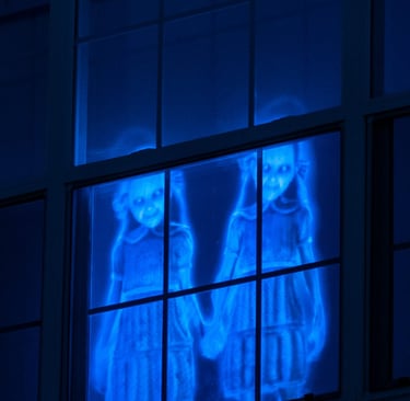 Halloween projector used to create images in window.