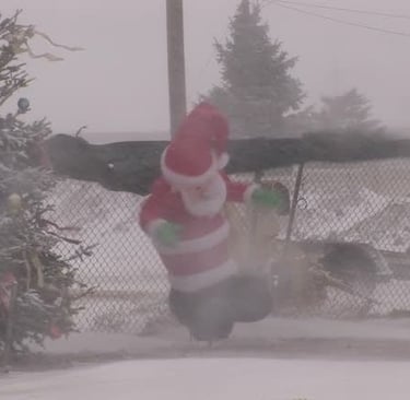 Inflatable Santa in snow storm