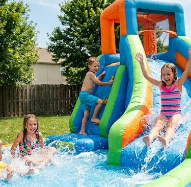 kids playing on inflatable water slide in backyard