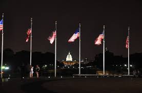US Flags illuminated at night