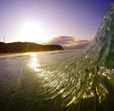 Sunset view from inside a wave at a beach break in Manta city