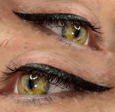 a woman with a black eyeliners and a pair of eyeliners