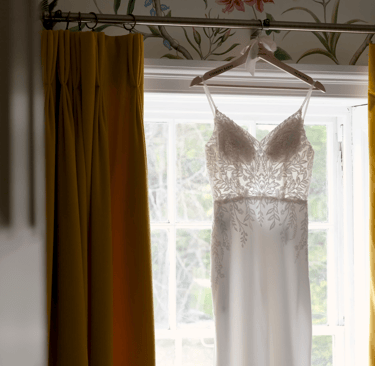 A wedding dress hanging up