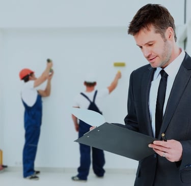 huissier réalisant un constat travaux