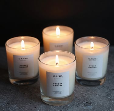 A cozy arrangement of glowing purple and orange scented candles surrounded by small crystals under a starry night backdrop