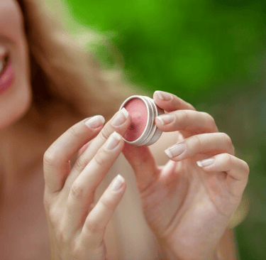 lip balm pretty young woman hold