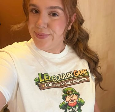 Woman wearing a St. Patrick's Day Leprechaun Game graphic tee shirt with shamrocks.