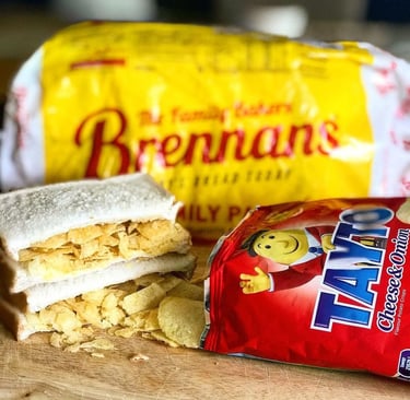 A classic Irish crisp sandwich made with Tayto Cheese and Onion crisps on white Brennans Bread.