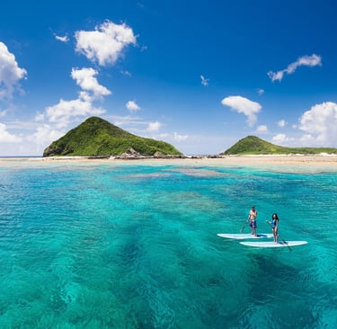 surfing in okinawa- picture of a couple surfing outside of okinawa island