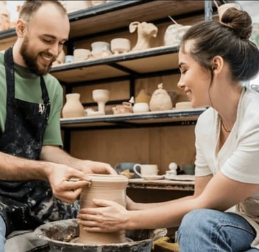 a happy couple on a date pottery night