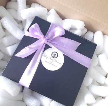sleek black magnetic gifting presentation box with coloured ribbon