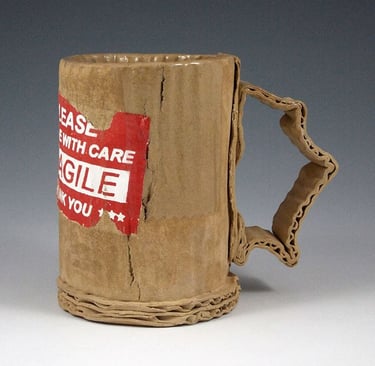 By artist Tim Kowalczyk. Handmade stoneware mug vs mass-produced pottery comparison.