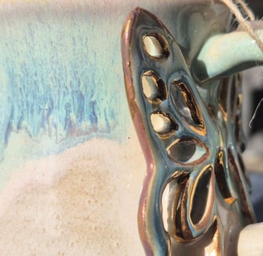 Side-by-side test: Gold lustre pottery after 100 dishwasher cycles showing faded, dull finish.