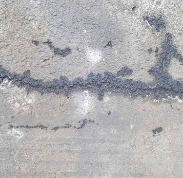 cracks in asphalt after winter