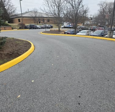 Front Royal curb painting with clean yellow fire lane curbs
