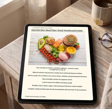 A tablet on a wooden table displays the OneLife Diet Meal Plan guide next to a cup of tea.