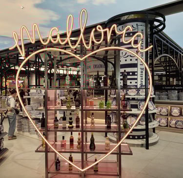 a heart shaped neon sign that says Mallorca at Mallorca airport.