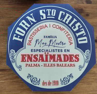 blue and white box filled with ensaimada Mallorca