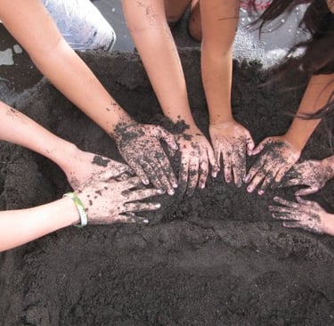 hands of children playing sand
