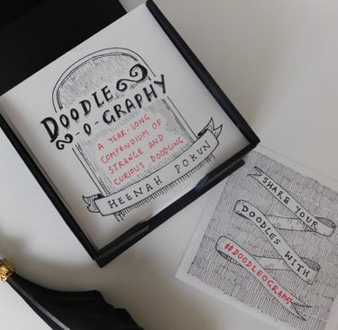 a photo of a memo block with gothic style doodles on it and a title called 'Doodle-o-Graphy'