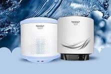 a couple of air purifier with a blue sky background