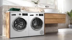 a washer and a washer in a bathroom