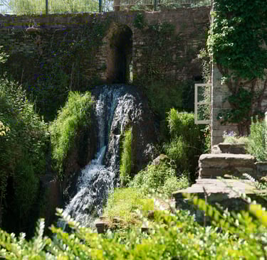 Waterfall beside Mill Cottage at Hanley Mill in the Teme Valley, peaceful countryside retreat.