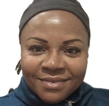 Shaded eyebrow tattoo giving gentle structure on rich brown skin tone”
