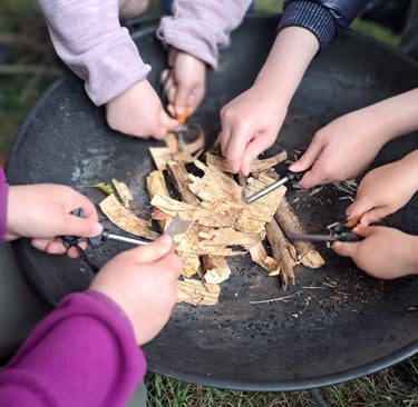 children lighting a fire