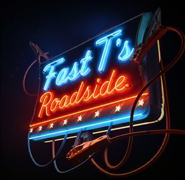 neon sign with jumper cables around it that says Fast T's Roadside