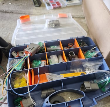 Automotive repinning and plug assortment on board Fast T's Mobile Service Trucks