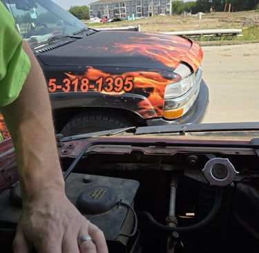 Fast T's Spark Plug Replacement Service on location in Waukee Iowa performing a spark plug replacement on a truck