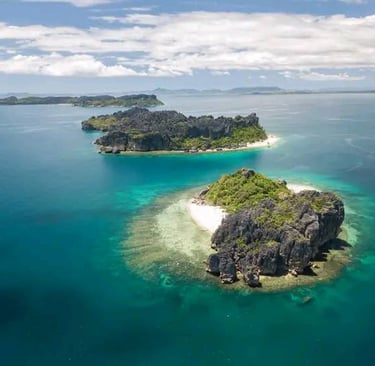 a small island with a small island in the middle of the ocean