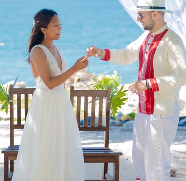 a man and woman standing in front of a white tent