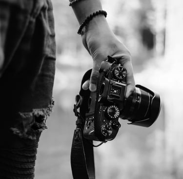 Street photographer carries his DSLR camera