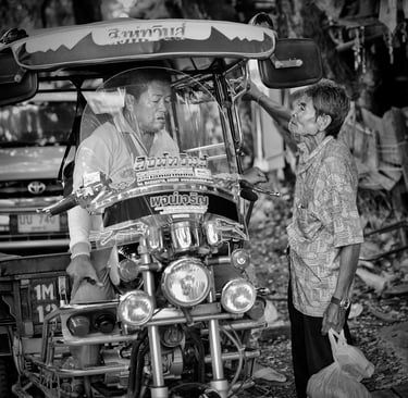 Negotiating a tuk-tuk ride in Thailand, spotted by Peter Pickering