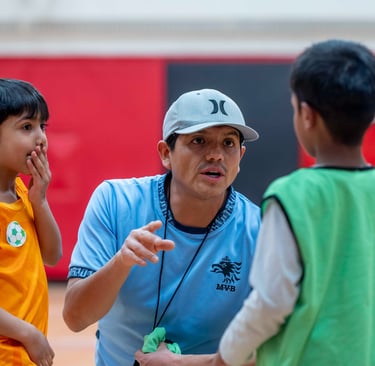 MVB F.C. soccer coach instructing young players training session in Mississauga Soccer School