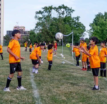 Young player practicing ball mastery repeatedly at MVB FC soccer school