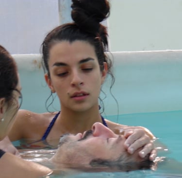 a man and woman in a swimming pool, rebirth and Repair, watsu