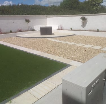 a large backyard with a lawn and a small garden