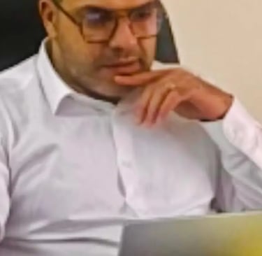 Business owner reviewing SEO website checklist on a laptop in a Croydon office