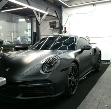 Satin PPF edge work on Porsche fender.