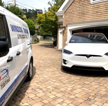 Tesla Model X with 5% Ceramic Window Tint is next to Bluemax Tint mobile service van at a client hom